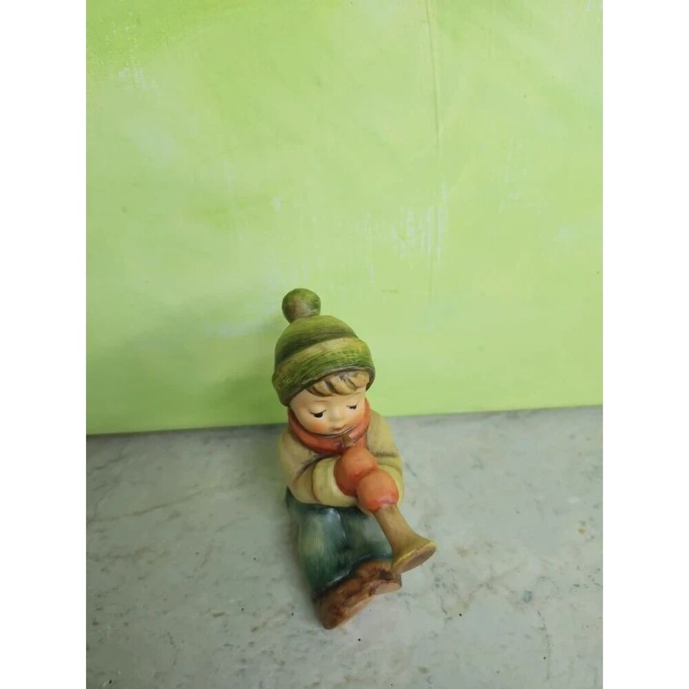 Goebel little boy with a horn dressed for winter signed